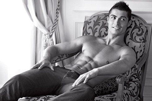 Cristiano Ronaldo lying in a chair for an Armani Jeans ad, showing off his abs