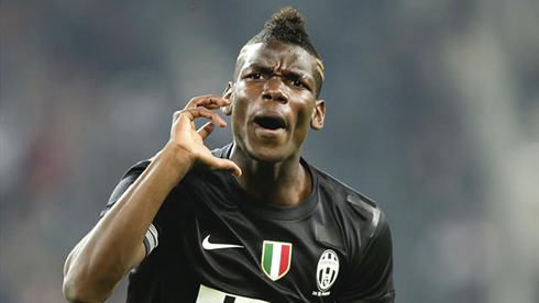 Paul Pogba celebrating goal for Juventus, in a black jersey for 2013-2014