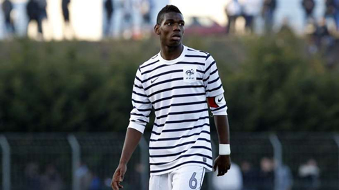 Paul Pogba wearing a France blue stripes jersey and shirt