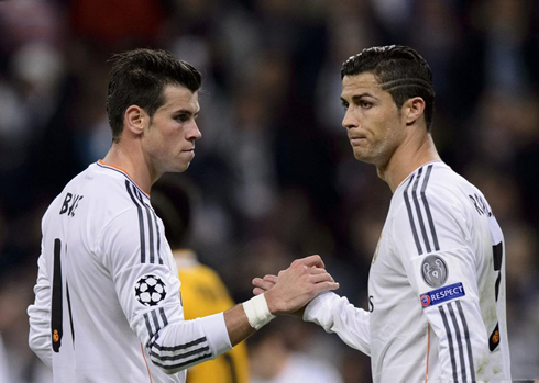 Cristiano Ronaldo shaking hands with Gareth Bale, in Real Madrid 2013-2014