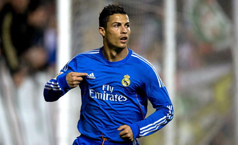 Cristiano Ronaldo pointing to Adidas logo, after a goal for Real Madrid