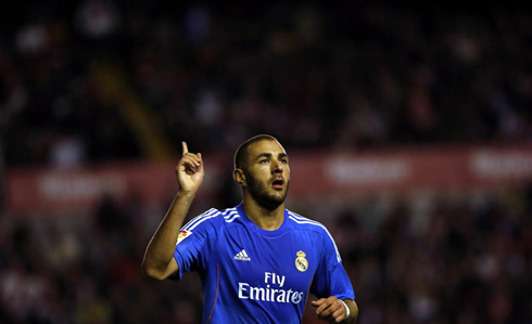 Karim Benzema raising one finger to the sky, as he celebrates his goal for Real Madrid