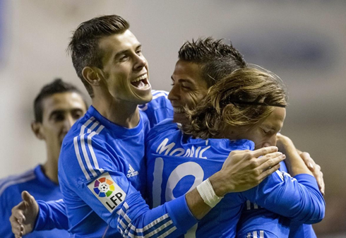 Real Madrid group hug between Bale, Ronaldo and Modric