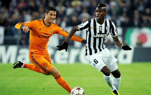Cristiano Ronaldo going after Paul Pogba, in Champions League