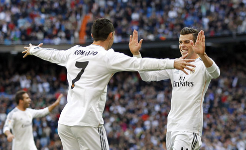 Cristiano Ronaldo welcoming Gareth Bale with his arms wide open