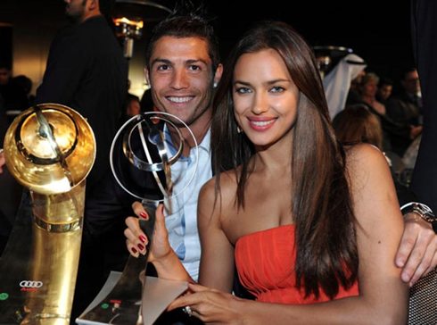 Cristiano Ronaldo and his girlfriend Irina Shayk, holding his latest trophies