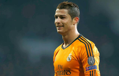 Cristiano Ronaldo in a Real Madrid orange jersey