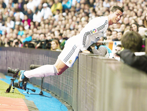 Cristiano Ronaldo in a funny position near the crowd