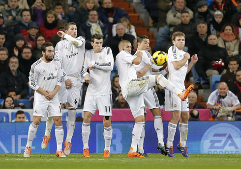 Cristiano Ronaldo turning his back on a Real Madrid wall, during a free-kick