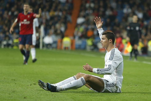 Cristiano Ronaldo waving and complaining while in the ground