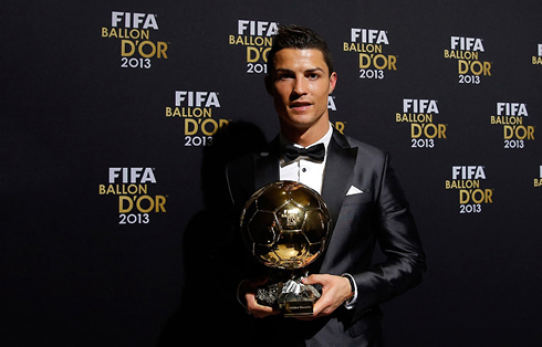 Cristiano Ronaldo holding the FIFA Ballon d'Or 2013 award