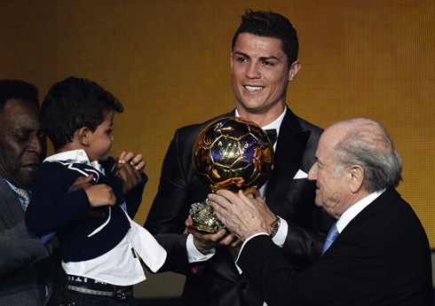 Cristiano Ronaldo next to his son when receiving the FIFA Ballon d'Or 2013
