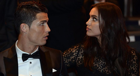 Cristiano Ronaldo seated next to Irina Shayk
