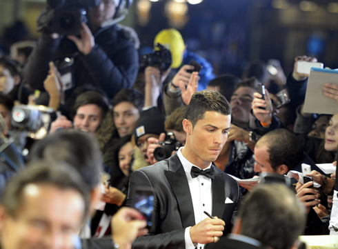 Cristiano Ronaldo signing autographs at the FIFA Ballon d'Or 2013 gala