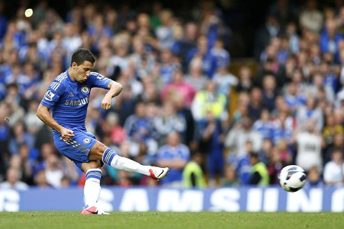 Eden Hazard striking the football