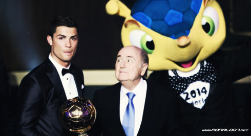 Cristiano Ronaldo receiving the FIFA Ballon d'Or, with Joseph Blatter astonished
