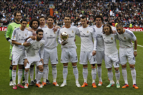 Cristiano Ronaldo and his Real Madrid teammates, taking a photo with the FIFA Ballon d'Or