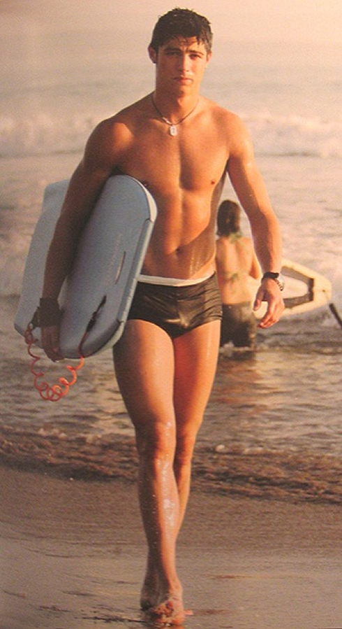 Cristiano Ronaldo at a young age on the beach, doing body board