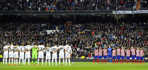 Real Madrid vs Atletico Madrid teams lined up, in the center of the pitch