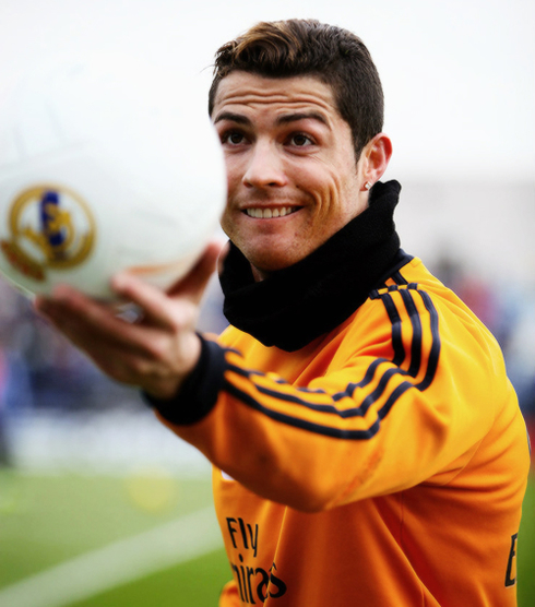 Cristiano Ronaldo handing out a football