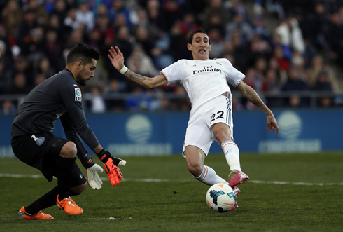 Angel Di María stretching to reach the ball