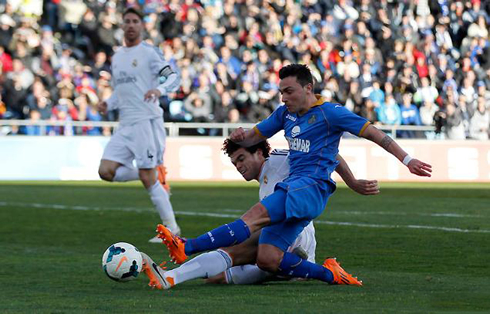 Pepe defending with an aggressive sliding tackle