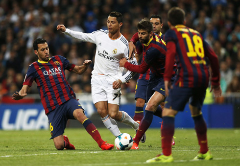 Cristiano Ronaldo being chased by Barcelona players in the Clasico
