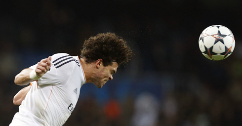 Pepe heading a ball while playing for Real Madrid, as a centre defender