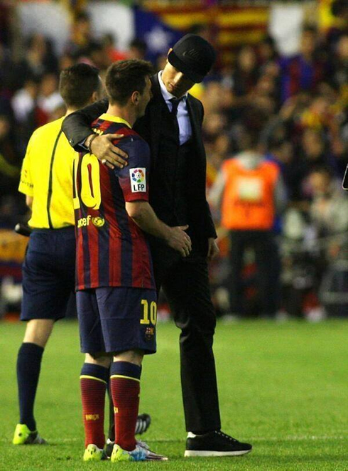 Cristiano Ronaldo comforting Lionel Messi