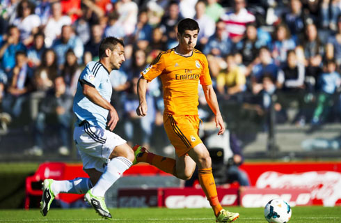 Alvaro Morata in an orange Real Madrid kit