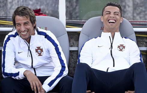 Cristiano Ronaldo in good mood, laughing next to Fábio Coentrão