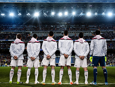 Real Madrid players wearing the white team jacket for 2014-2015
