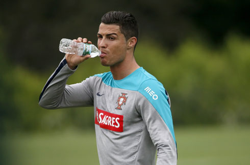 Cristiano Ronaldo drinking water from a bottle