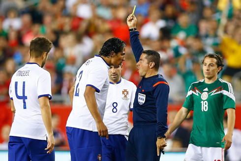Bruno Alves yelling at the referee right in his face
