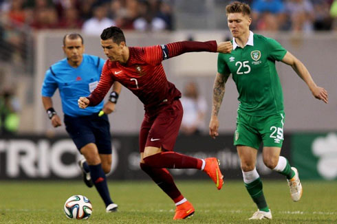 Cristiano Ronaldo takes off and leaves a defender behind him in a World Cup 2014 friendly