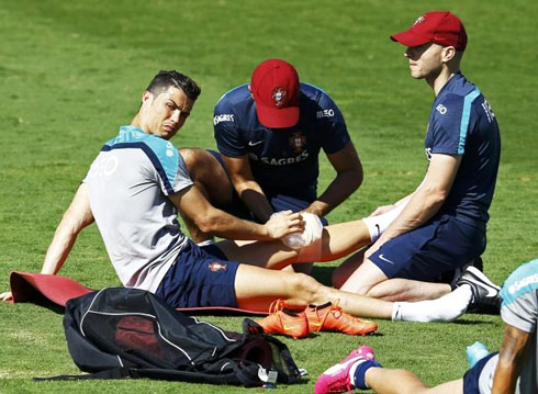 Cristiano Ronaldo receiving treatment on his knee injury, at a FIFA World Cup 2014 training session
