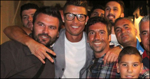 Cristiano Ronaldo taking a photo with fans in Mykonos, Greece, during his 2014 vacations