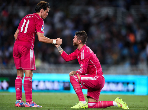 Gareth Bale helping Sergio Ramos standing up