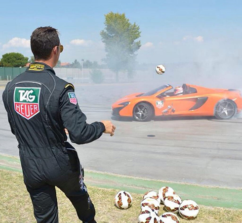 Cristiano Ronaldo kicking footballs at Jenson Button, in a McLaren F1