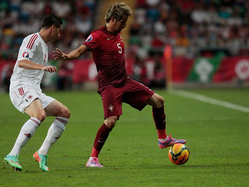 Fábio Coentrão guarding the ball with his body, in Portugal vs Albania