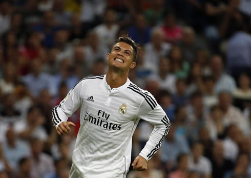 Cristiano Ronaldo smiling of frustration, after missing an opportunity to score