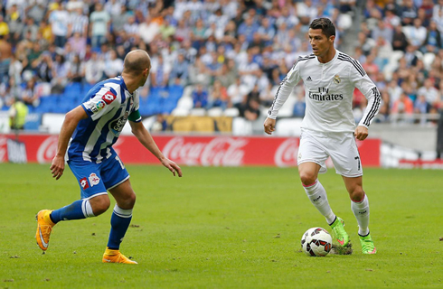 Cristiano Ronaldo taking on a defender in Deportivo vs Real Madrid
