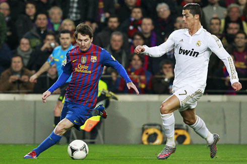 Cristiano Ronaldo chasing Messi in a Barcelona vs Real Madrid Clasico