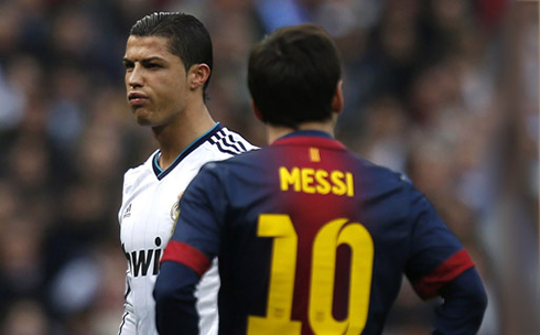 Cristiano Ronaldo standing next to Lionel Messi