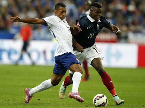 Nani challenging Pogba for a loose ball