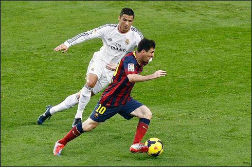 Cristiano Ronaldo on the run, chasing Lionel Messi