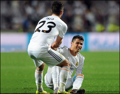 Isco helping Cristiano Ronaldo to stand up