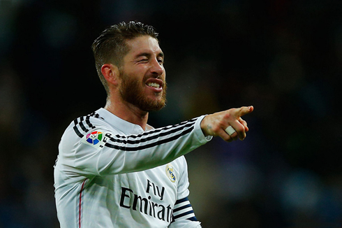 Sergio Ramos blinking his eye and pointing to a teammate
