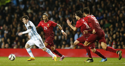 Lionel Messi escaping several Portuguese defenders