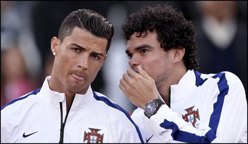 Pepe telling a secret to Cristiano Ronaldo